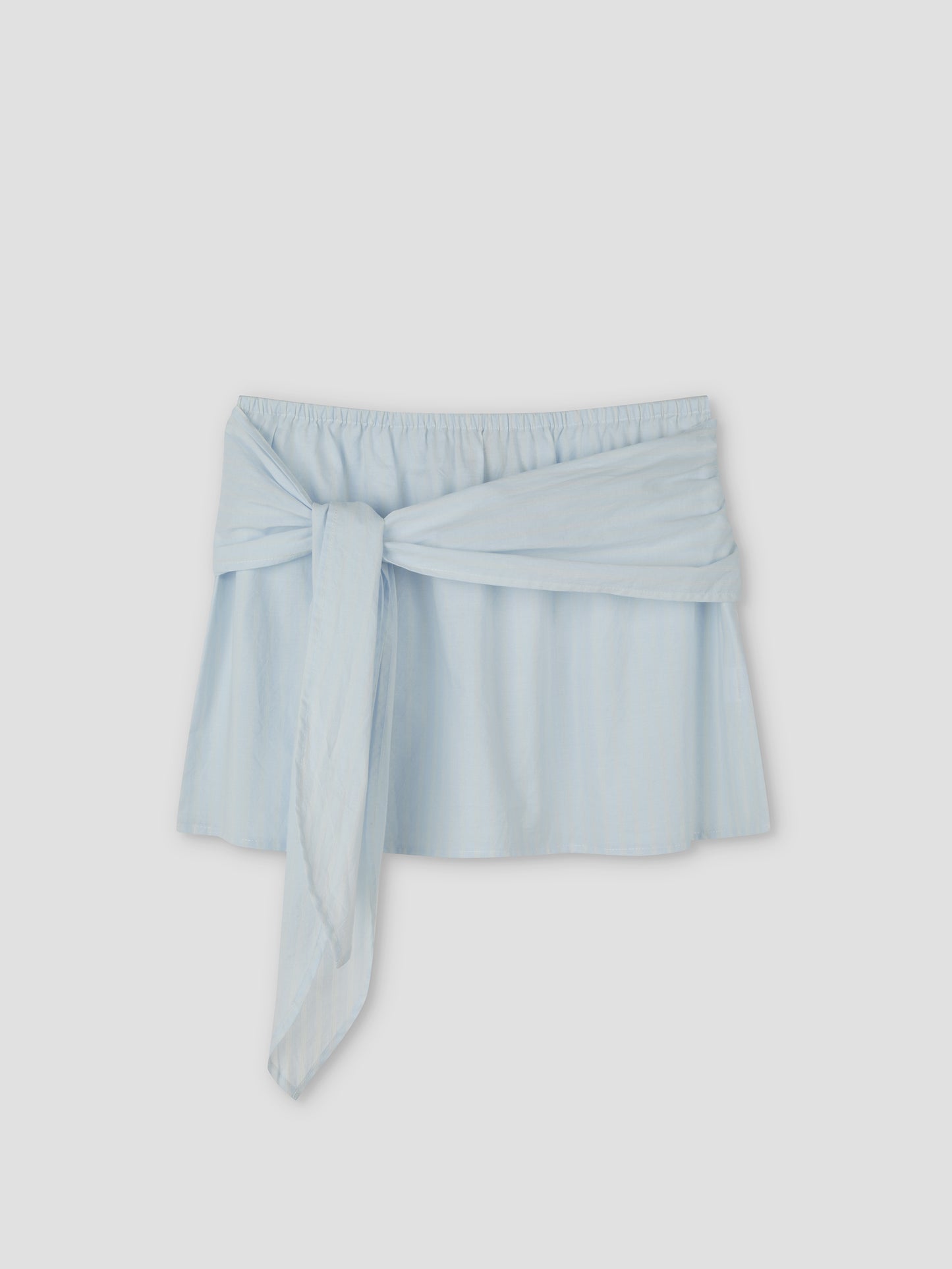 Belted Skirt - Powder Blue Stripe by Deiji Studios, with an elastic waistband and wide matching fabric tie at the front, shown against a plain light gray background.