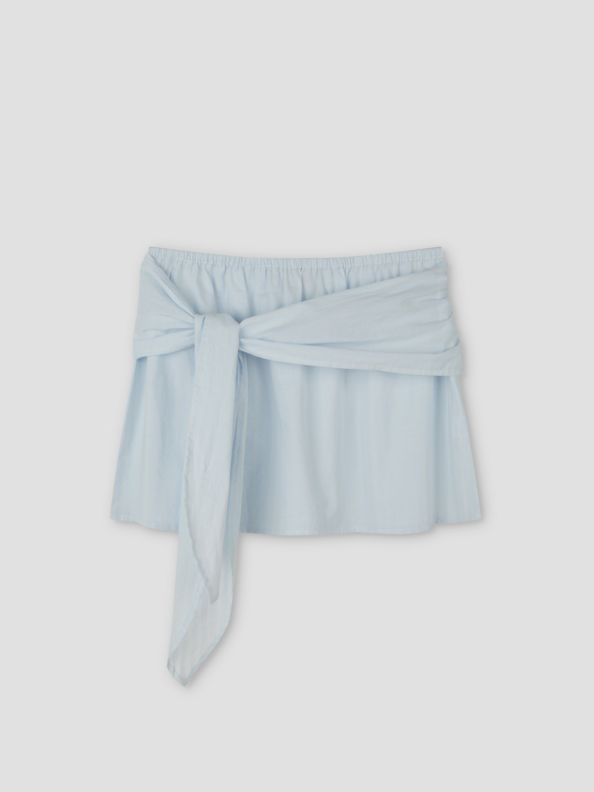 Belted Skirt - Powder Blue Stripe by Deiji Studios, with an elastic waistband and wide matching fabric tie at the front, shown against a plain light gray background.