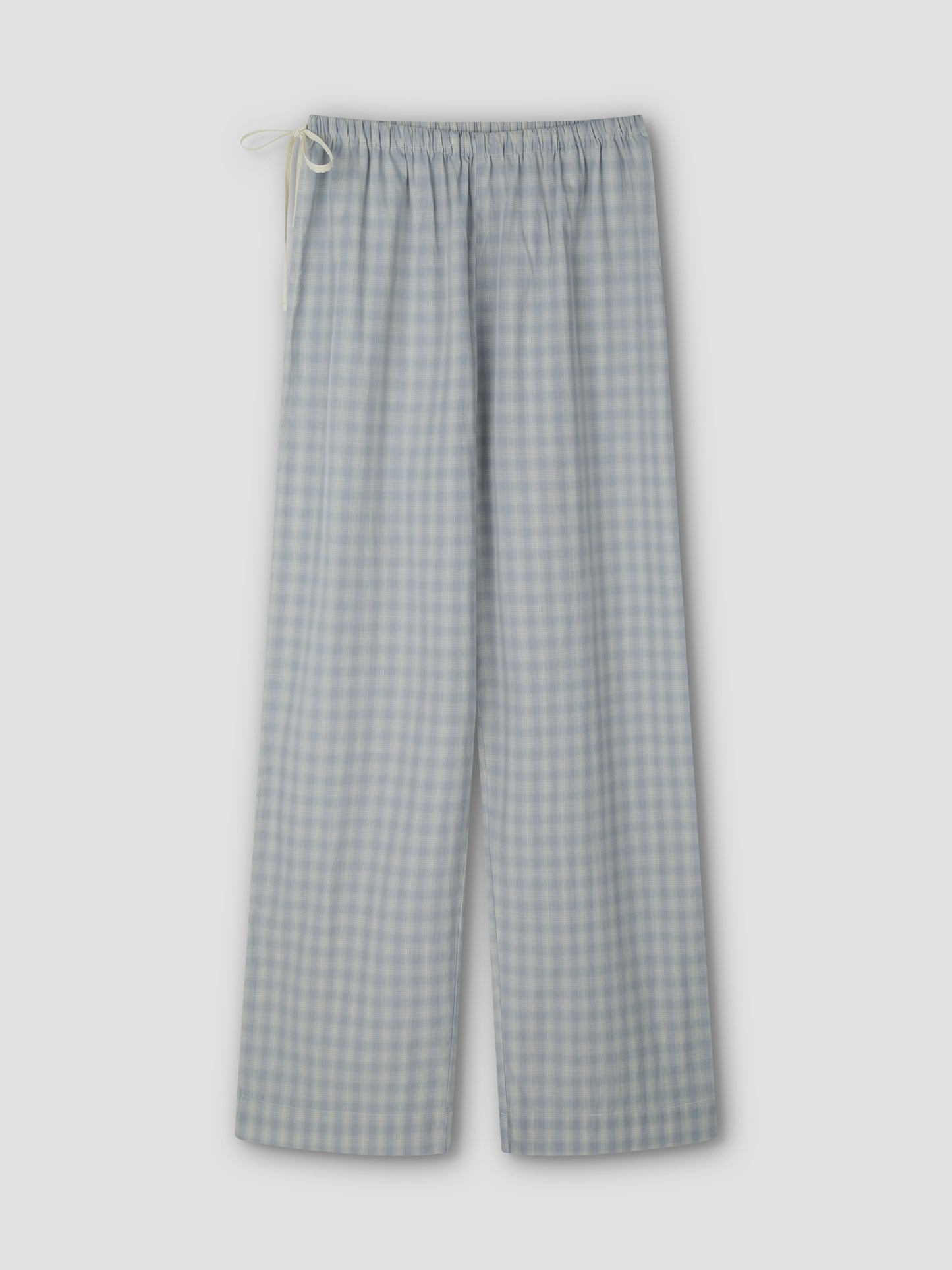 The Side Tie Pant - Blue Check features light blue and white cotton poplin checks, an elastic waistband, and a white drawstring, shown flat on a light grey background.
