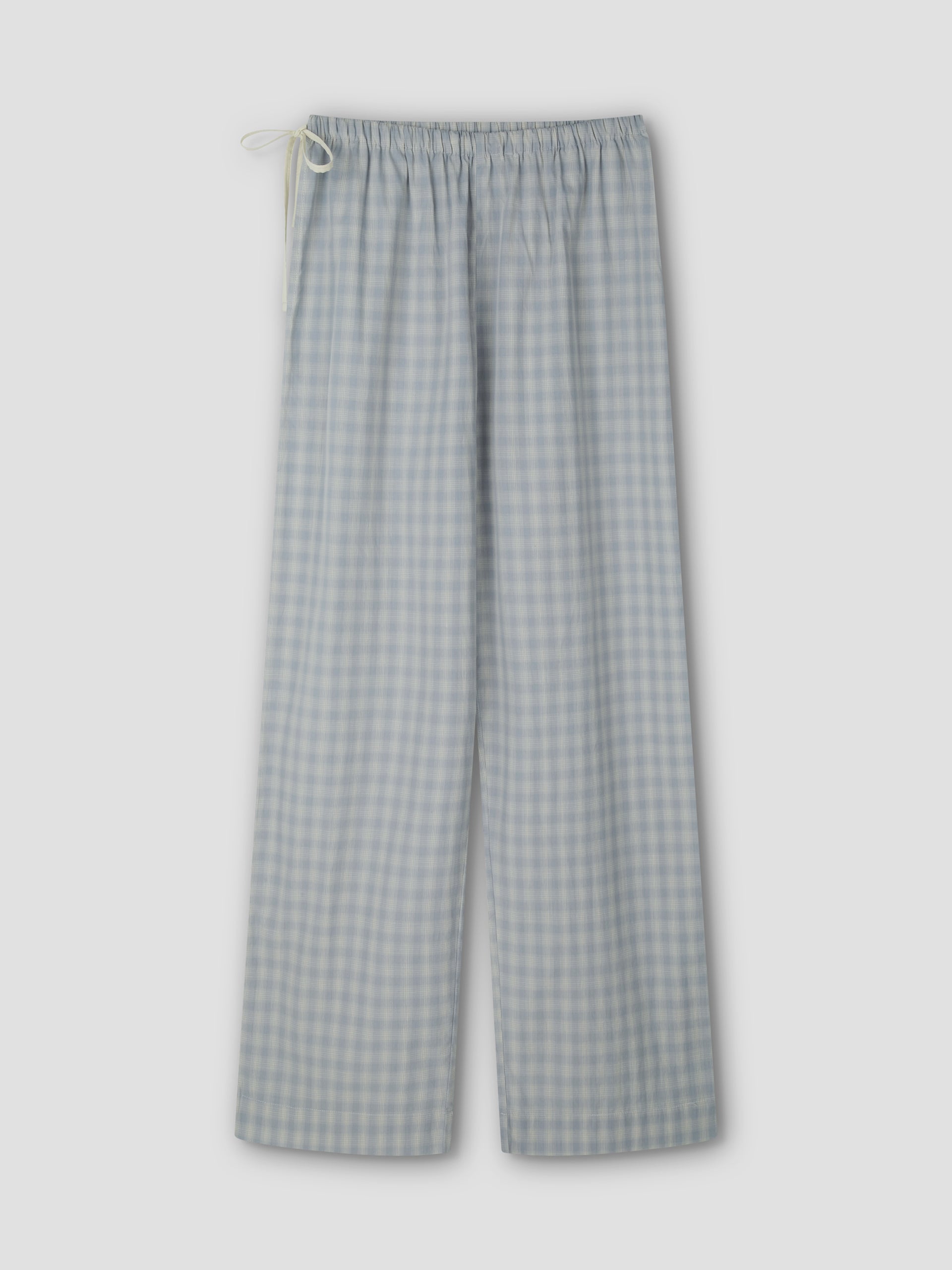 The Side Tie Pant - Blue Check features light blue and white cotton poplin checks, an elastic waistband, and a white drawstring, shown flat on a light grey background.