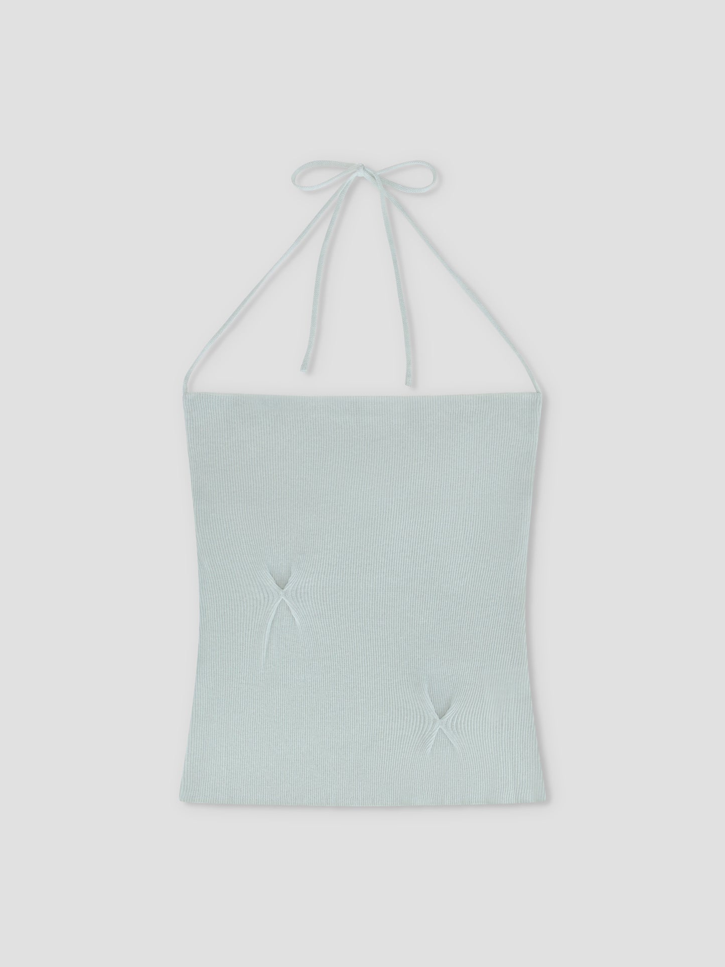 The Fine Knot Tank - Ice Blue by Deiji Studios is a light blue halter tank with thin neck tie straps and two subtle star-shaped gathers on the front, crafted from recycled polyester and shown laid flat on a white background.