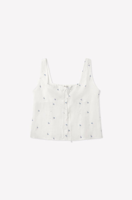 The Relax Short Set - Floral Blue features a white sleeveless crop top with a square neckline, blue floral prints, front buttons, and a drawstring chest detail—shown laid flat on a plain white background.