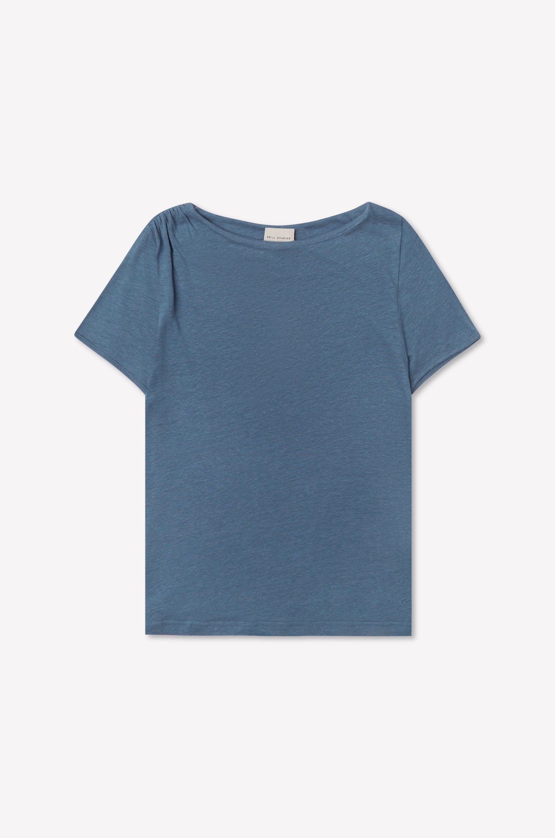 The Drape Tee - Blue features a plain design with short sleeves and a boat neckline, shown against a white background.