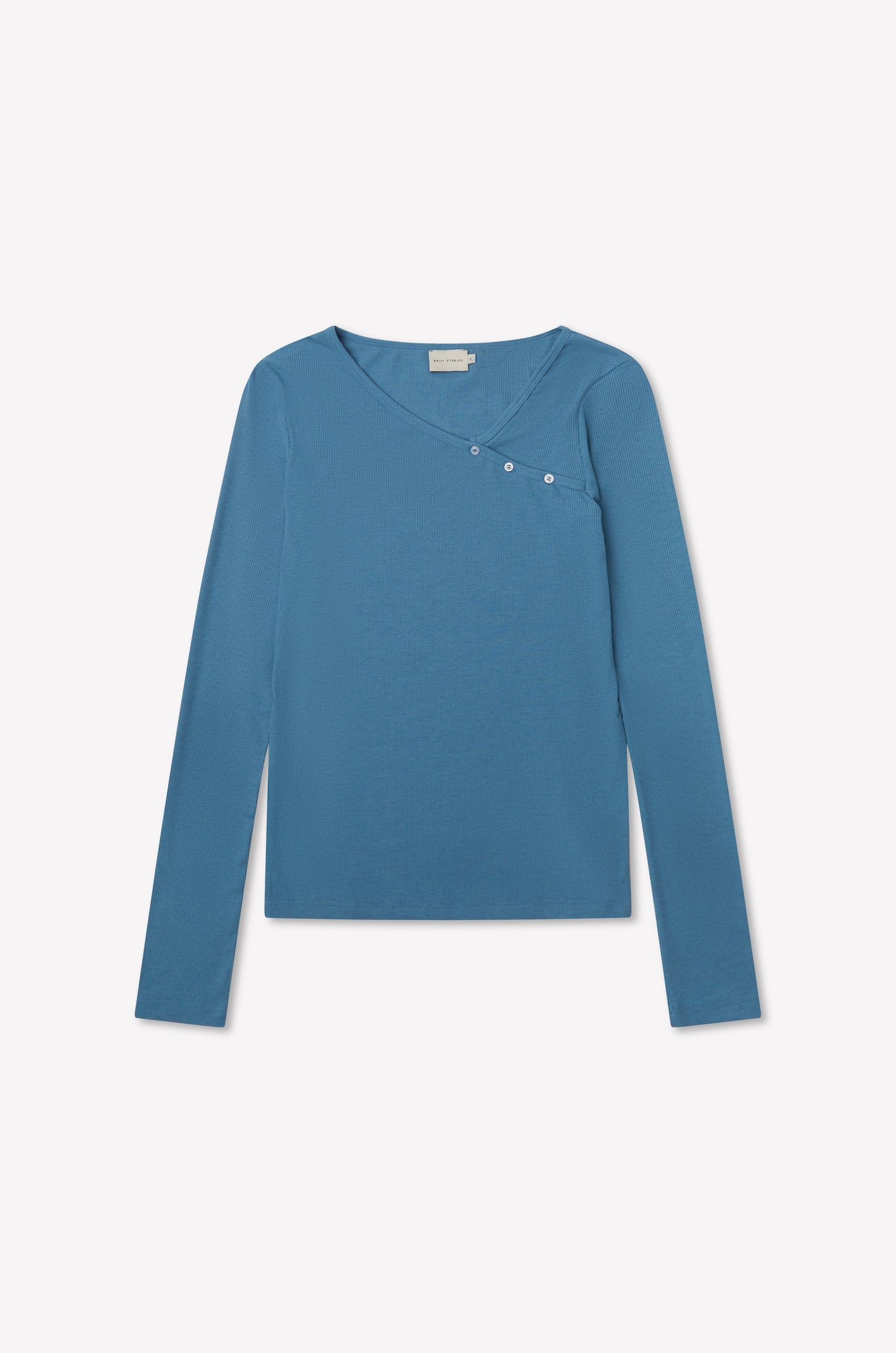 The Multi Button Top - Aqua by deiji studios is a fitted long sleeve jersey in blue with an asymmetrical neckline and three small buttons on the upper right, shown on a plain white background.