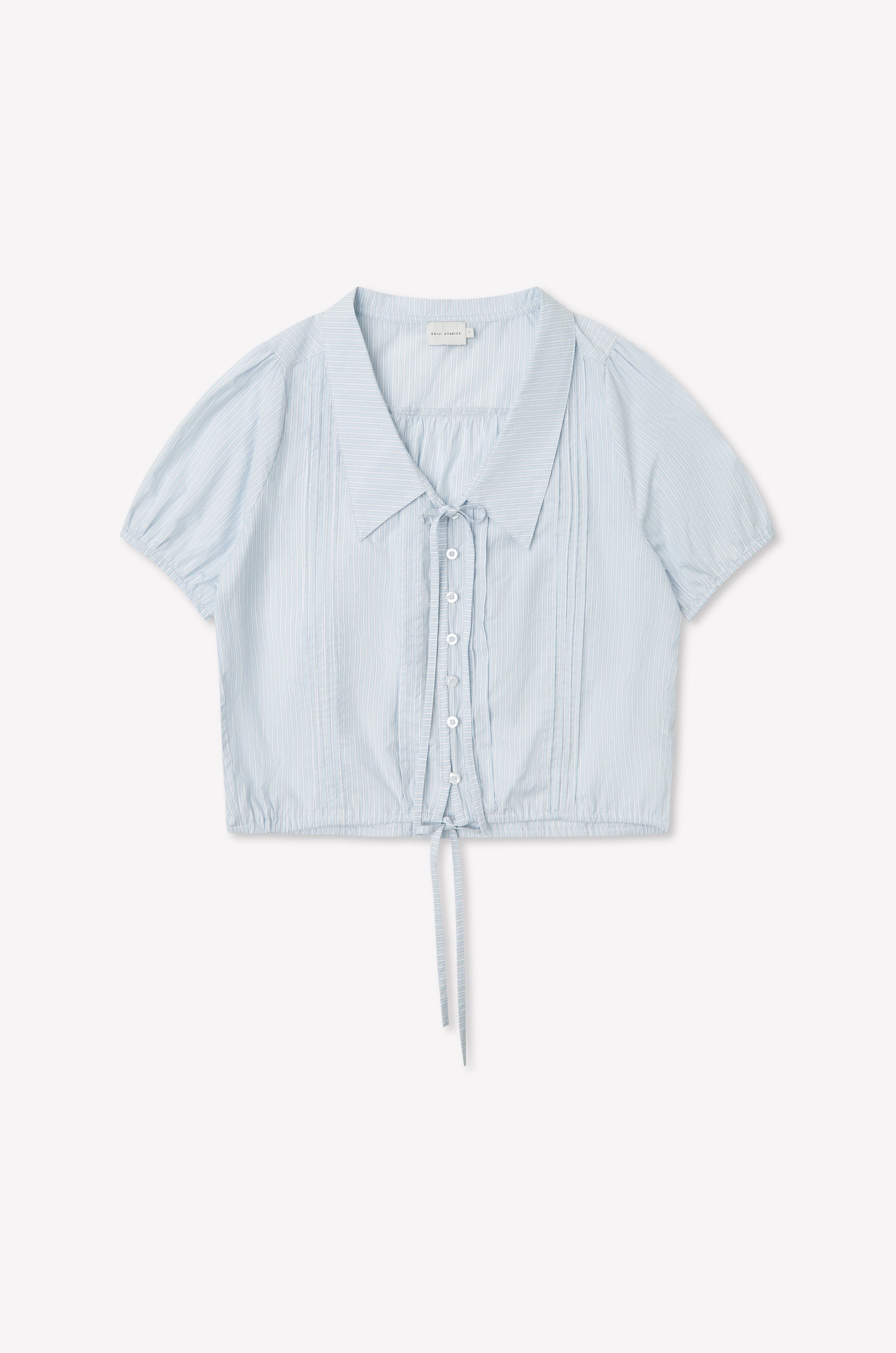 The Fine Collar Top - Mist Stripe features a light blue vertical stripe design, short sleeves, fine collar, button-down front, and drawstring waist. Made from lightweight cotton poplin for a casual, airy look inspired by Deiji Studios.