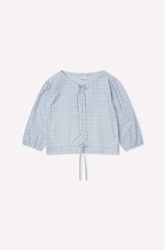 The Corded Top - Powder Check features a light blue, long sleeve design with a subtle check pattern, button-up front, V-neckline, drawstring waist, and slightly puffed sleeves. Inspired by Deiji Studios. Displayed flat on a white background.