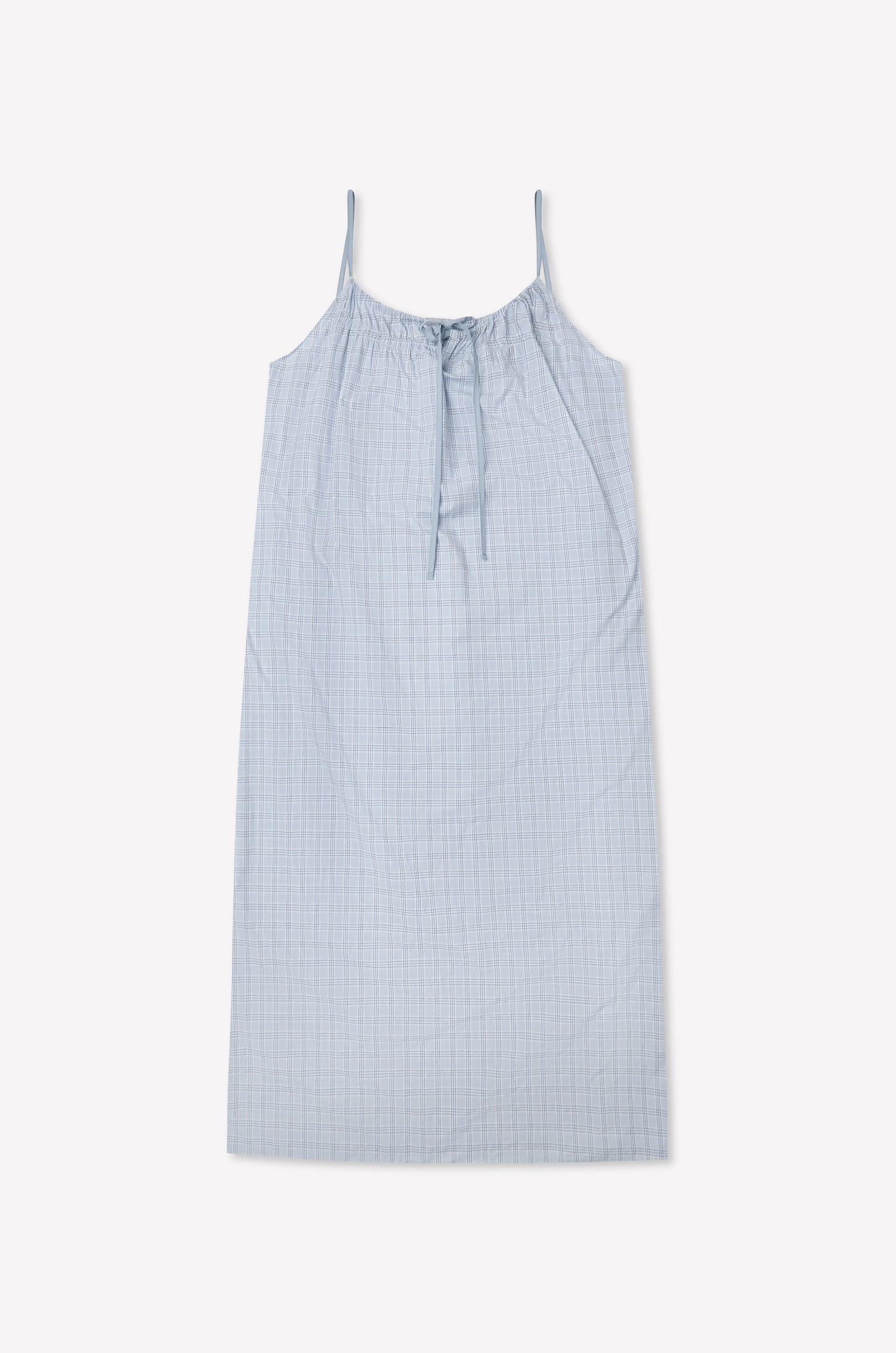 The Light Maxi Dress - Powder Check by Deiji Studios is a light blue sleeveless maxi made from organic cotton with thin straps, a gathered tie neckline, and a subtle check pattern, shown flat against a white background.