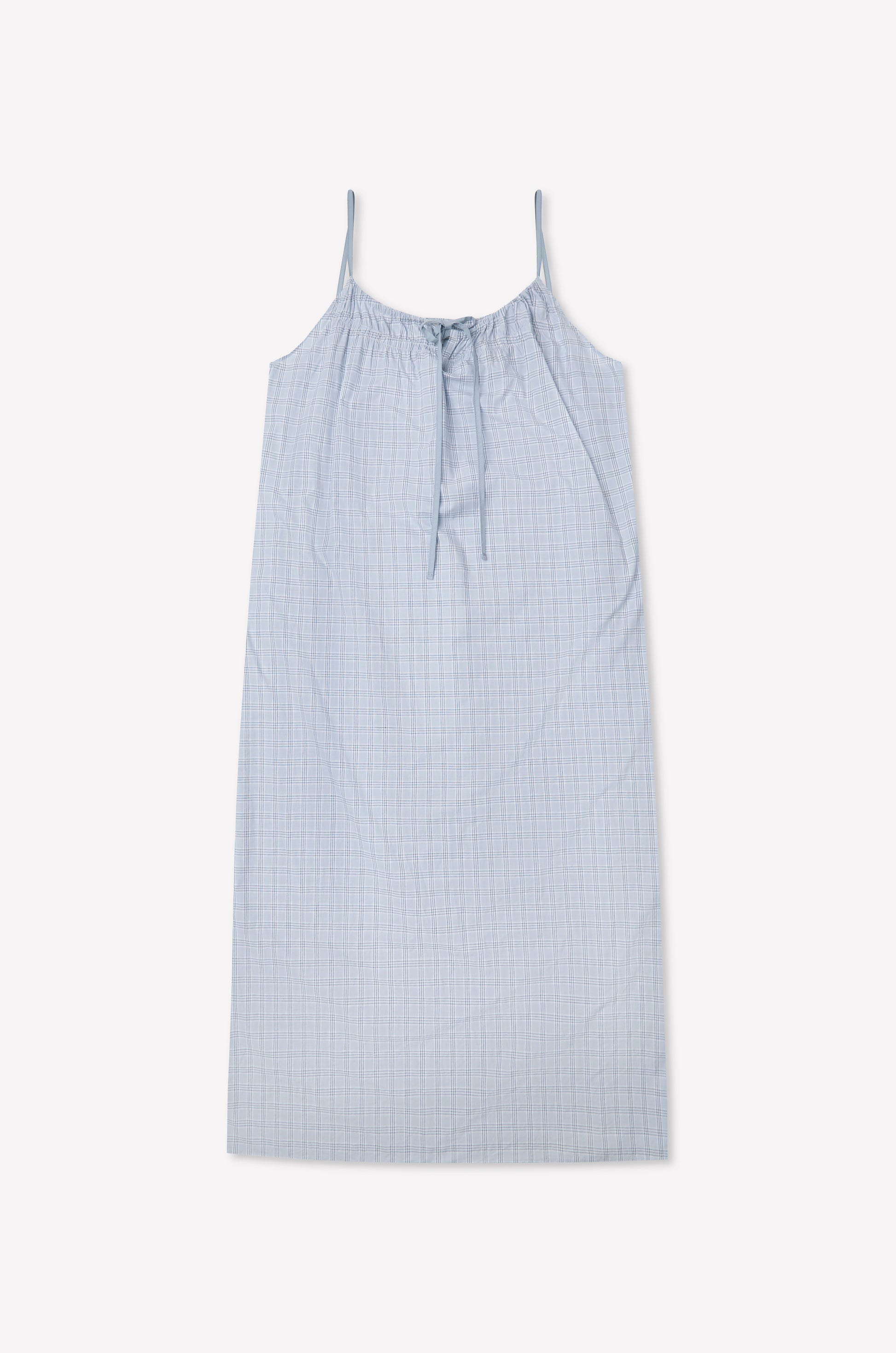 The Light Maxi Dress - Powder Check by Deiji Studios is a light blue sleeveless maxi made from organic cotton with thin straps, a gathered tie neckline, and a subtle check pattern, shown flat against a white background.