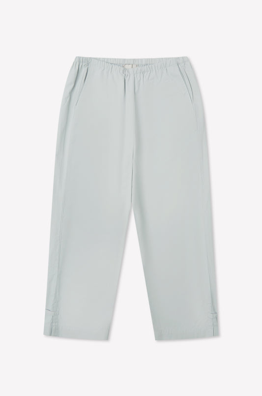 Baby blue Capri Pant featuring a relaxed cropped fit, elasticated waistband, side pockets, and subtle seam details at the hem, laid flat on a white background.