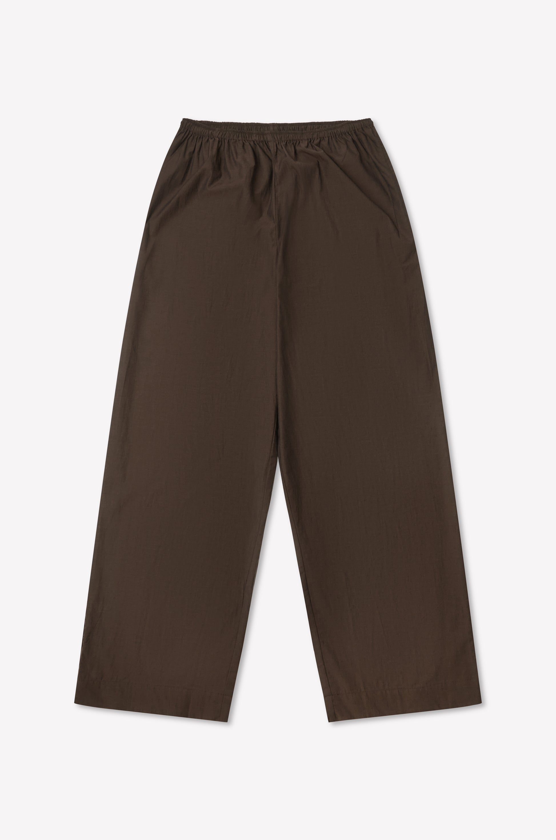 The Ease Trouser - Toast is a wide-leg brown pant with an elastic waistband, ankle length, and minimalist design. Laid flat on a plain white background, it features no visible pockets or extra details.