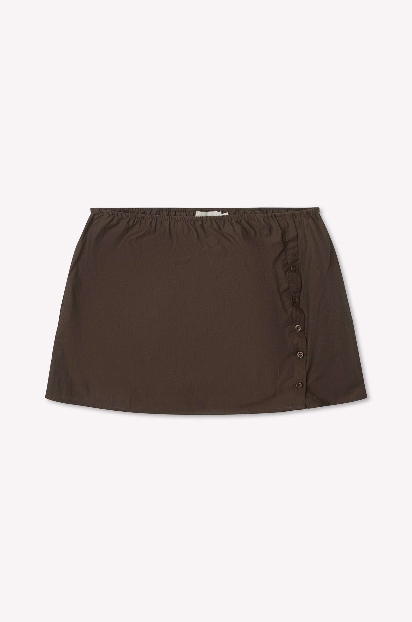 The Pleat Split Skirt - Toast is a brown cotton poplin mini skirt with an elastic waistband and side button detailing, shown laid flat on a white background.