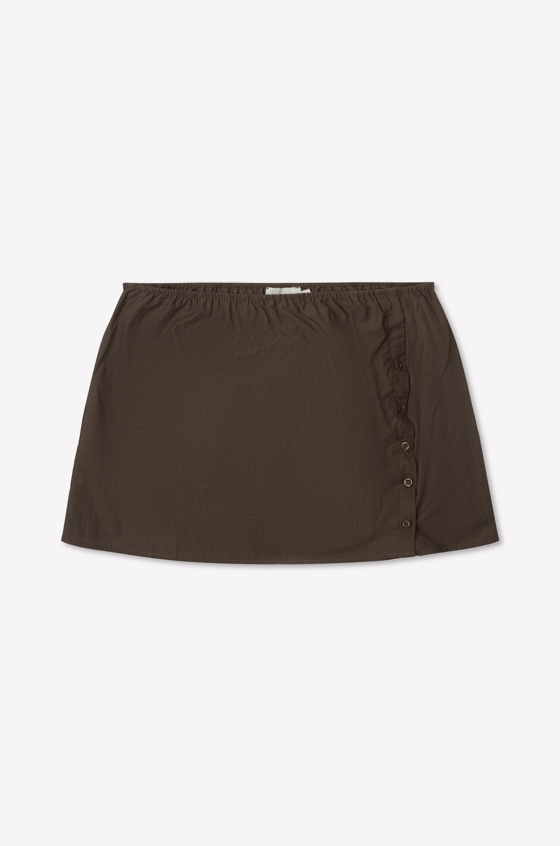 The Pleat Split Skirt - Toast is a brown cotton poplin mini skirt with an elastic waistband and side button detailing, shown laid flat on a white background.