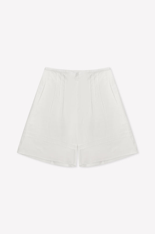 The Pintuck Short - White is a high-waisted cotton poplin short featuring subtle pintuck detailing and a minimalist design, shown against a plain white background.