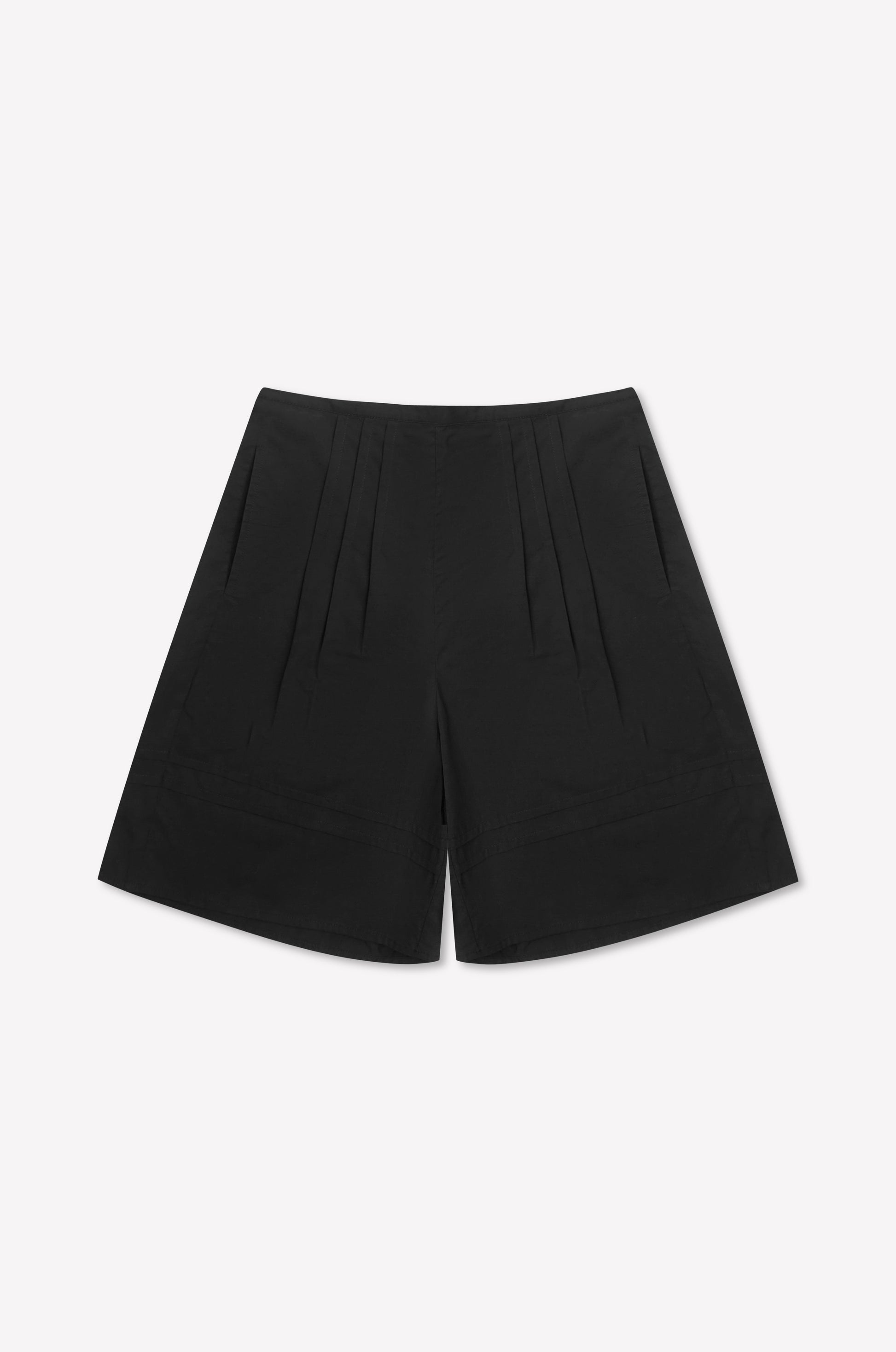 The Pintuck Short - Black is a high-waisted cotton poplin short with pintuck detailing, front pleats, and side pockets, shown on a plain white background.