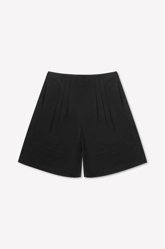 The Pintuck Short - Black is a high-waisted cotton poplin short with pintuck detailing, front pleats, and side pockets, shown on a plain white background.