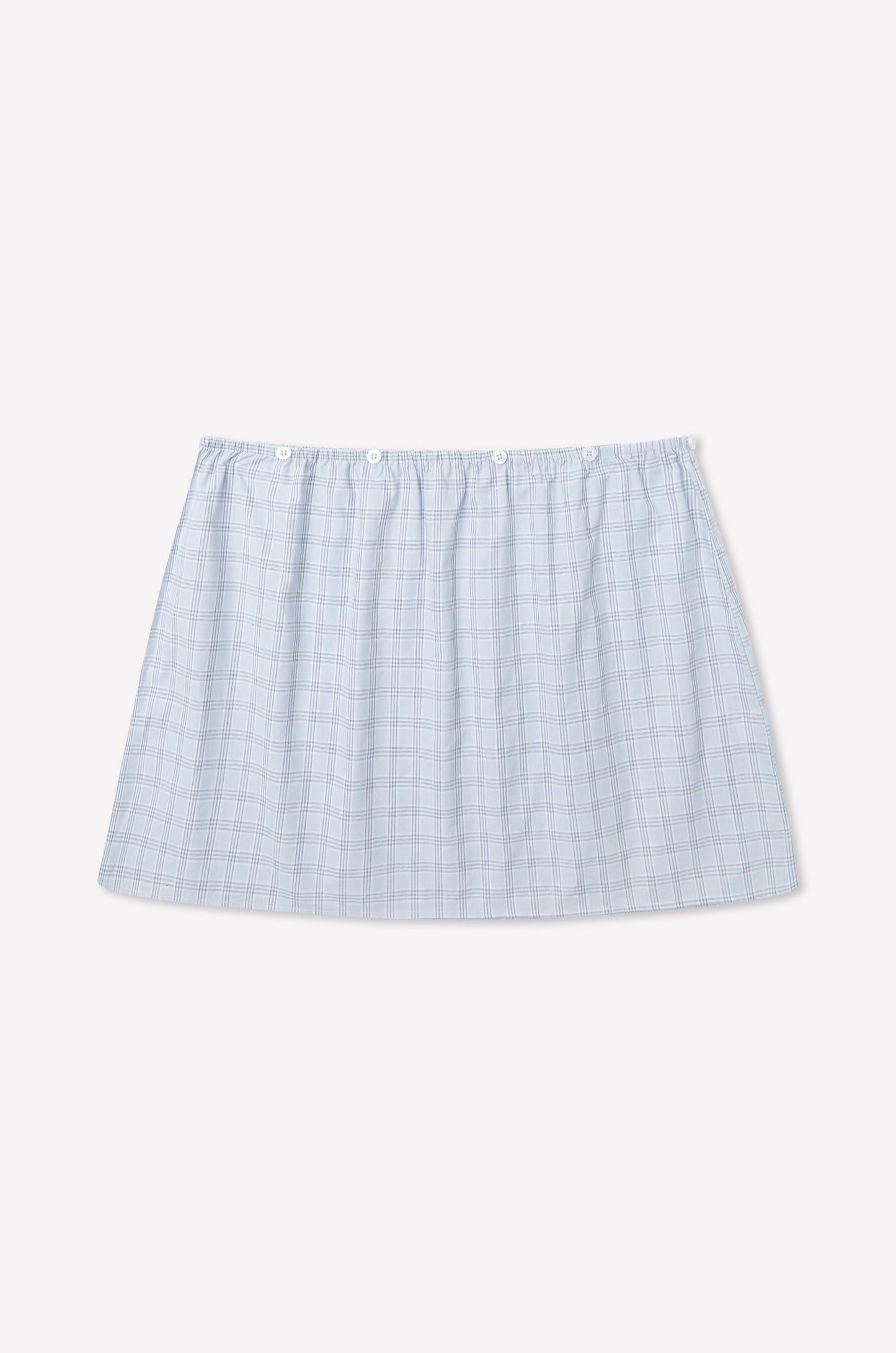 A light blue plaid Flow Top in Powder Check, inspired by Deiji Studios, with a straight hem and elastic waistband, displayed on a plain white background.