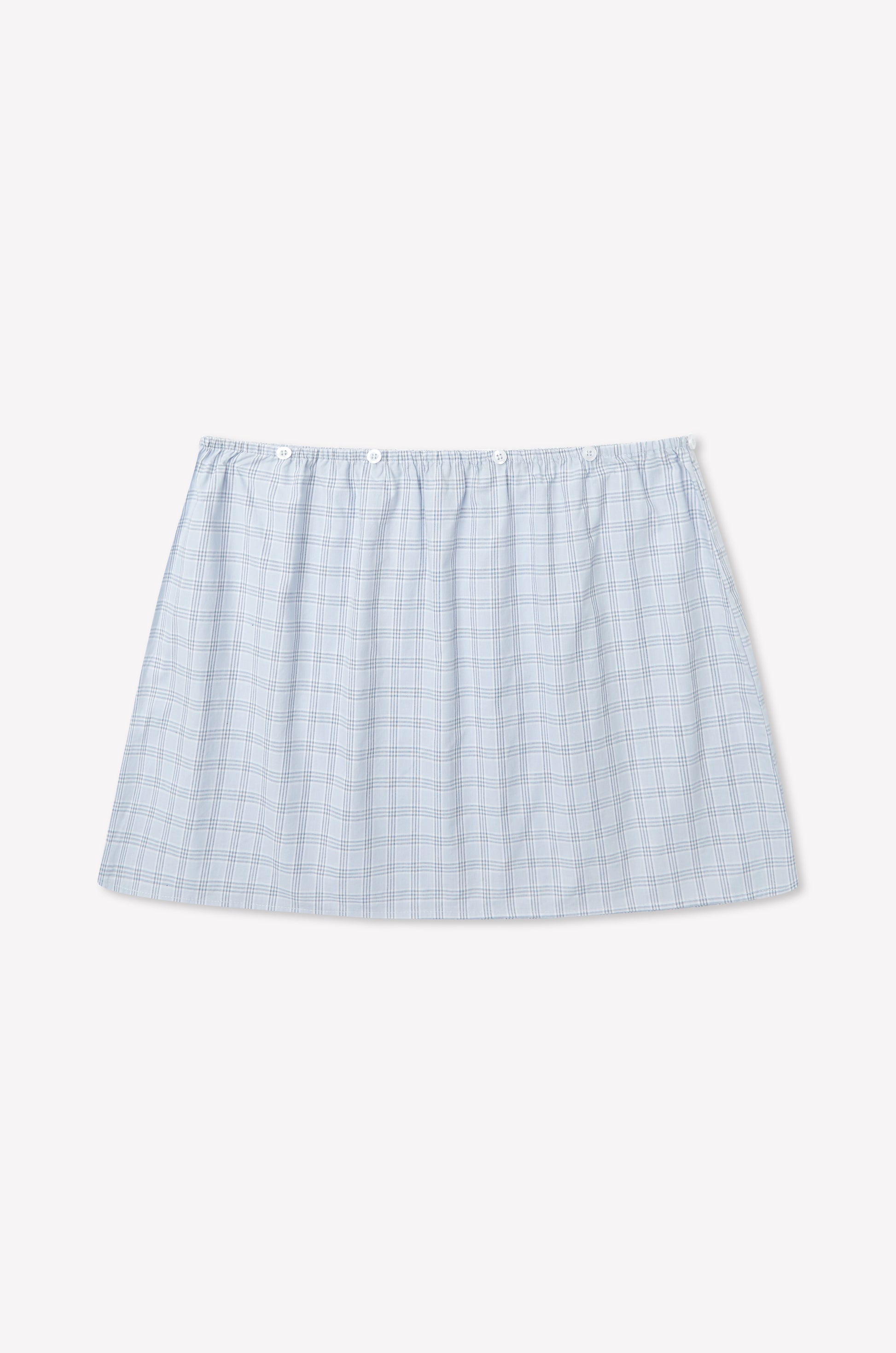 A light blue plaid Flow Top in Powder Check, inspired by Deiji Studios, with a straight hem and elastic waistband, displayed on a plain white background.