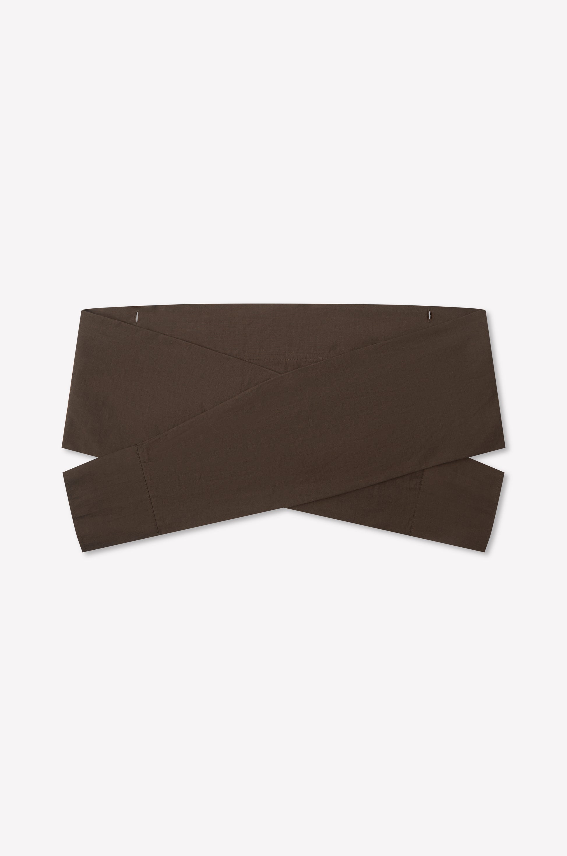 The Shirt Cuff Belt - Toast by Deiji Studios is a wide, dark brown cotton poplin belt with a crisscross design, shown flat on a white background.