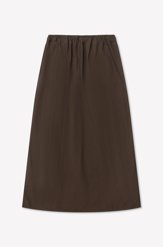 The Way Skirt - Toast is a brown, full-length skirt with an elastic waistband. Made from lightweight fabric and shown on a white background, its minimalist design captures Deiji Studios' timeless aesthetic.