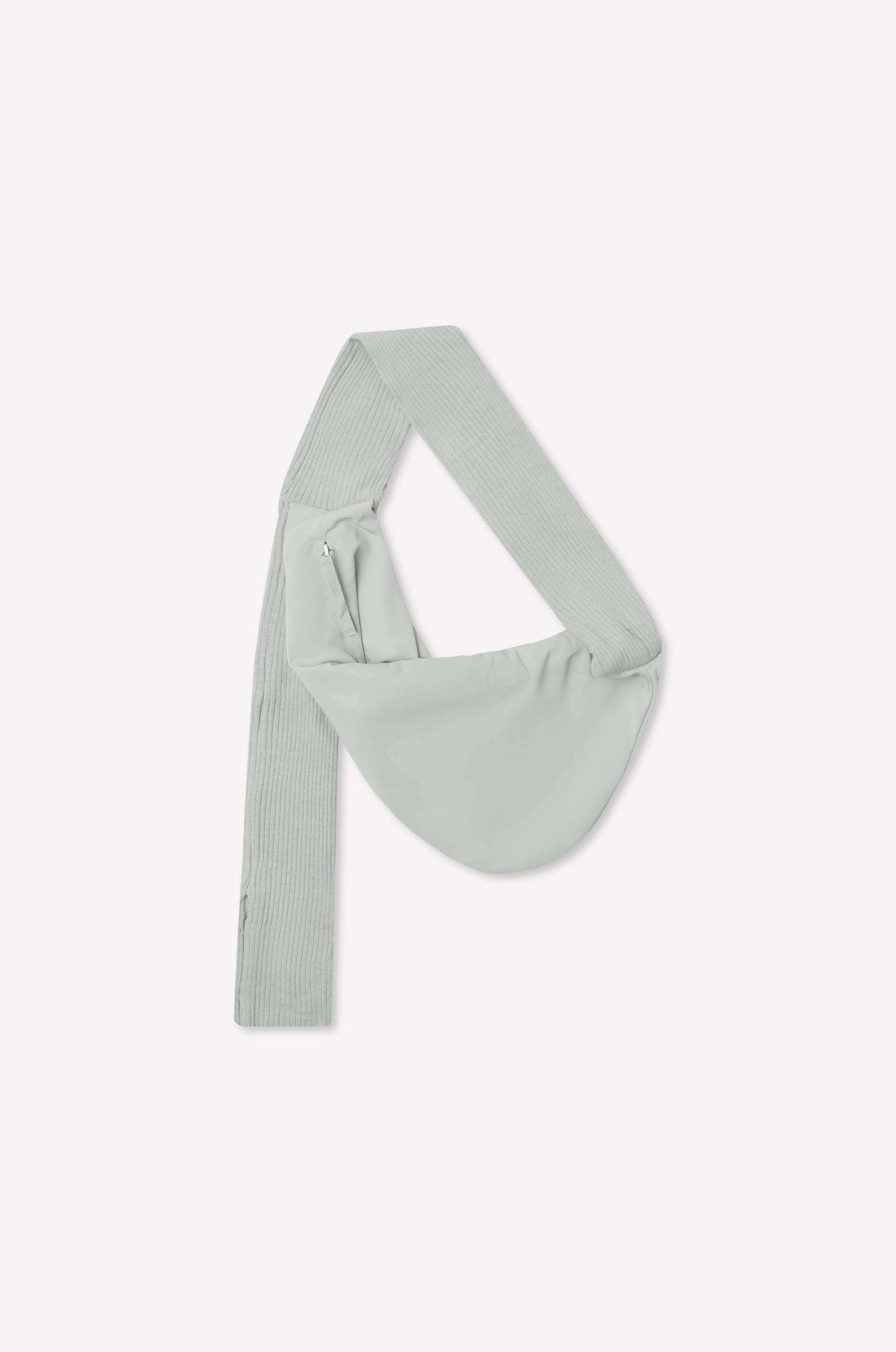 A baby blue asymmetrical sling saddle bag, named Knit Strap Bag, features a wide, ribbed knit shoulder strap and a side zipper, displayed against a plain white background.