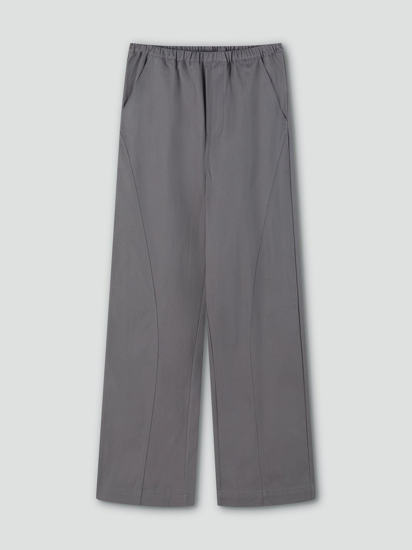 Curve Pant - Lavendar Smoke by Deiji Studios: wide-leg, relaxed fit trousers in lavender grey with curved seams, elastic waistband, and side pockets. Shown flat on a light grey background.