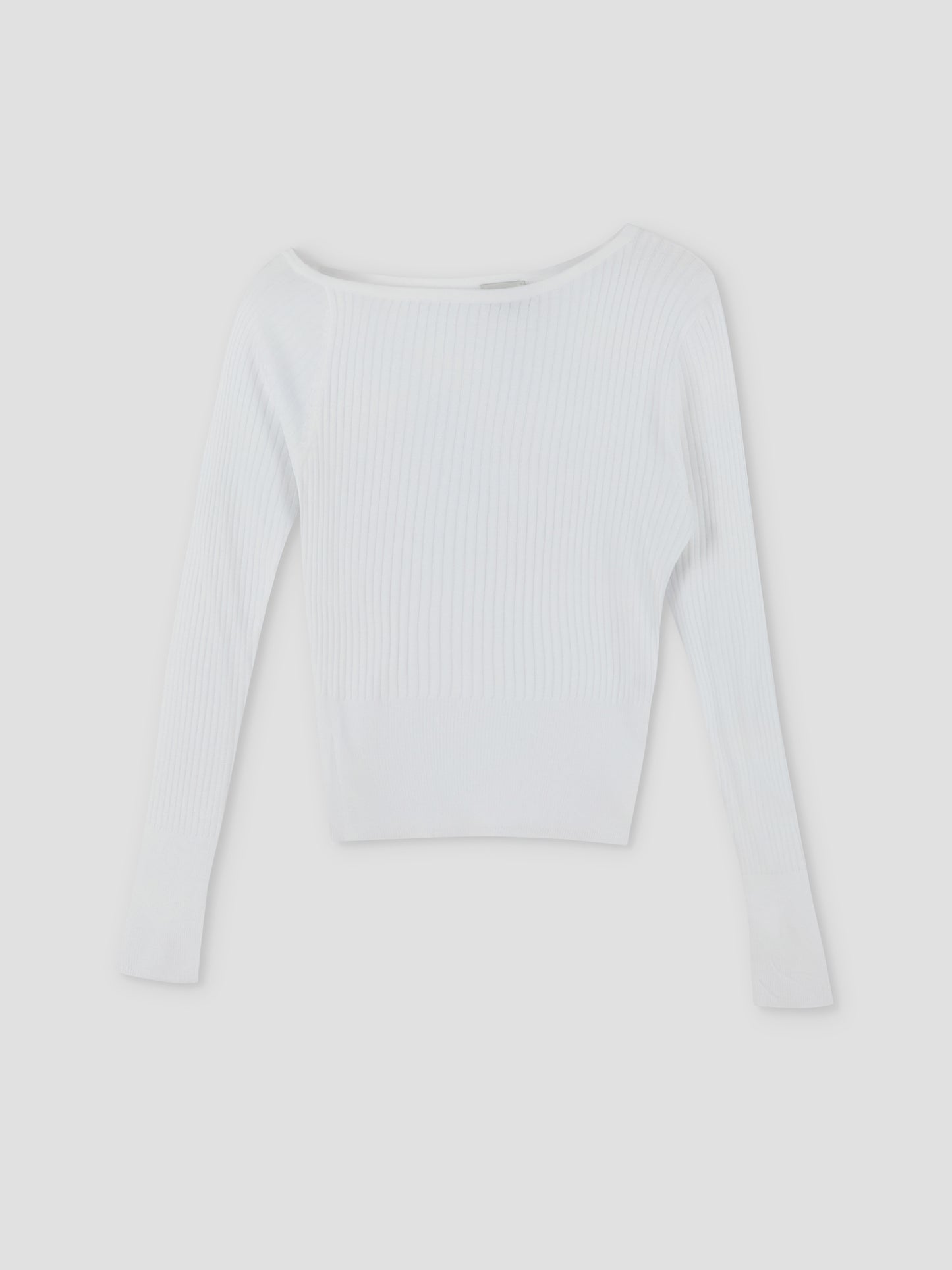The Shoulder Knit Top - White by Deiji Studios features long sleeves, a wide neckline, and a ribbed texture, shown laid flat on a plain light background.