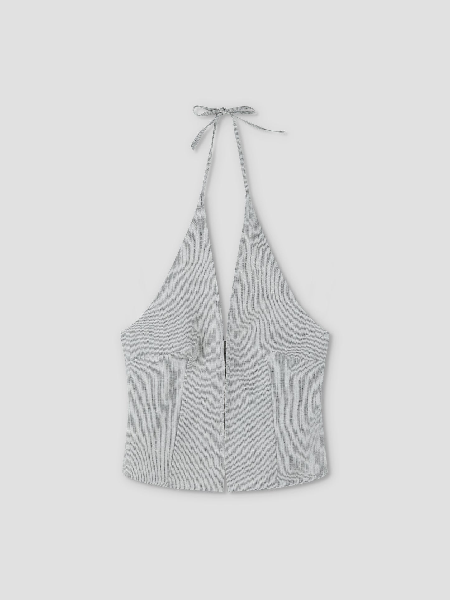 The Close Halter Top - Fine Stripe by Deiji Studios features a light gray hue, deep V neckline, fine stripe pattern, fitted silhouette, and neck tie closure, shown against a plain light background.