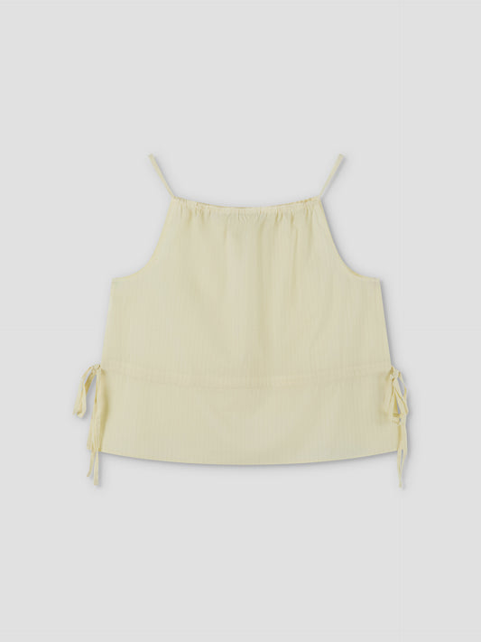 A Waist Tie Top - Soft Yellow Stripe by Deiji Studios, featuring thin shoulder straps and adjustable side ties, is displayed sleeveless and flat against a plain background.
