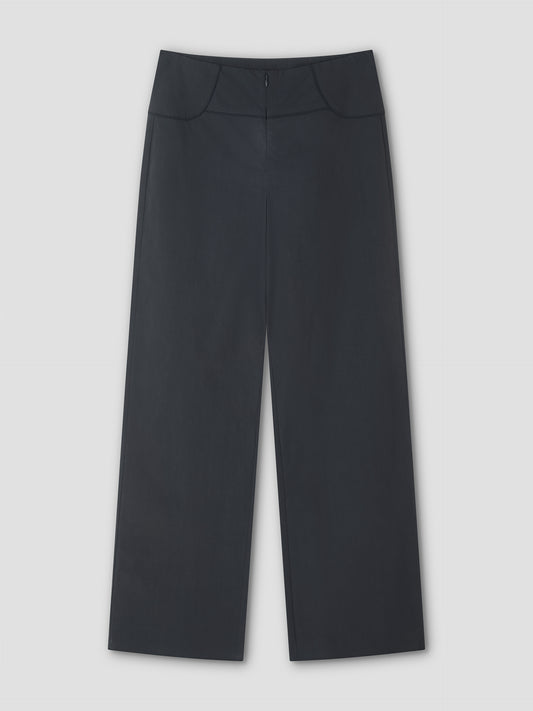 The Panelled Pant - Charcoal by Deiji Studios, featuring a wide-leg, high-waisted design with smooth front, minimal seams, and a clean finish, is laid flat against a light gray background.