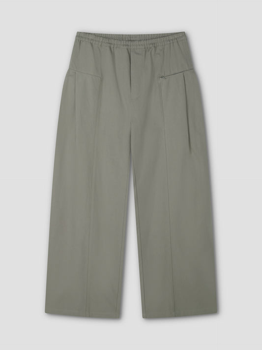 Pleat Pant - Sage Grey: Relaxed straight leg pant with pleats, elastic waistband, and two front pockets, shown laid flat on a light gray background.