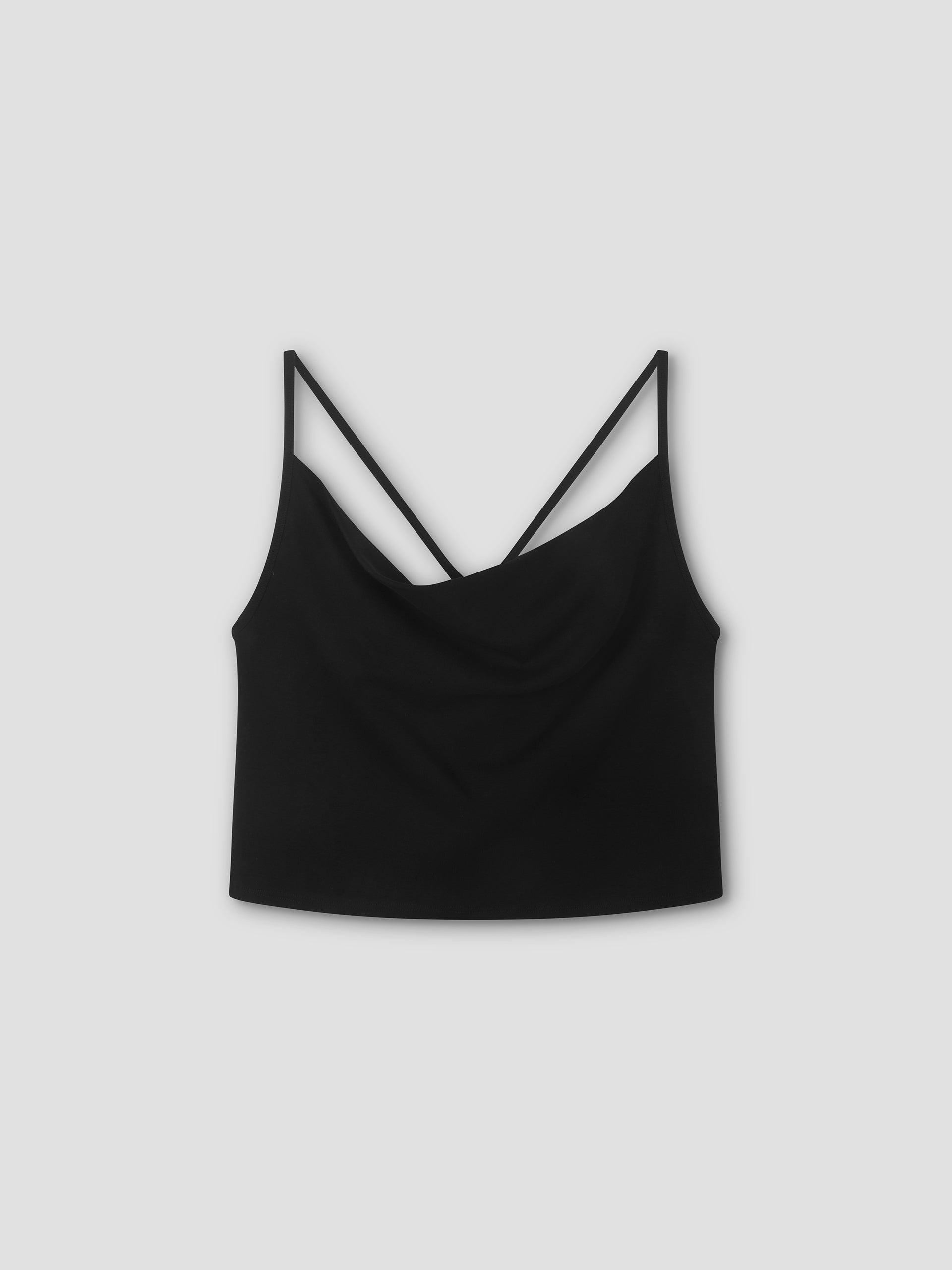 The Drape Jersey Top - Black is a lightweight sleeveless jersey top with thin spaghetti straps and a gently draped neckline, shown on a plain light gray background, reflecting Deiji Studios’ minimal aesthetic.