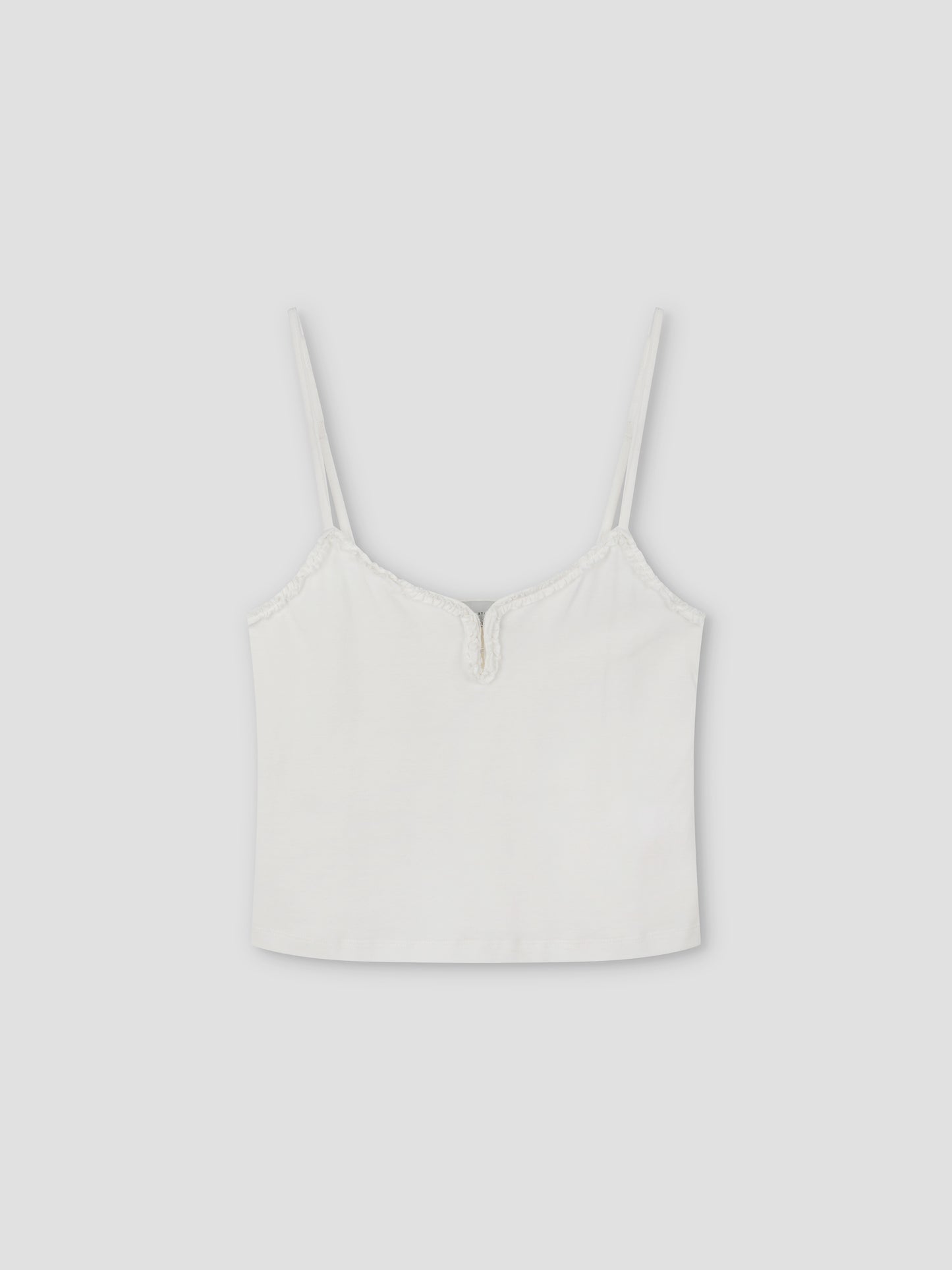 The Clasp Singlet - White is a tank top inspired by Deiji Studios, featuring a sleek zipper for a modern touch.