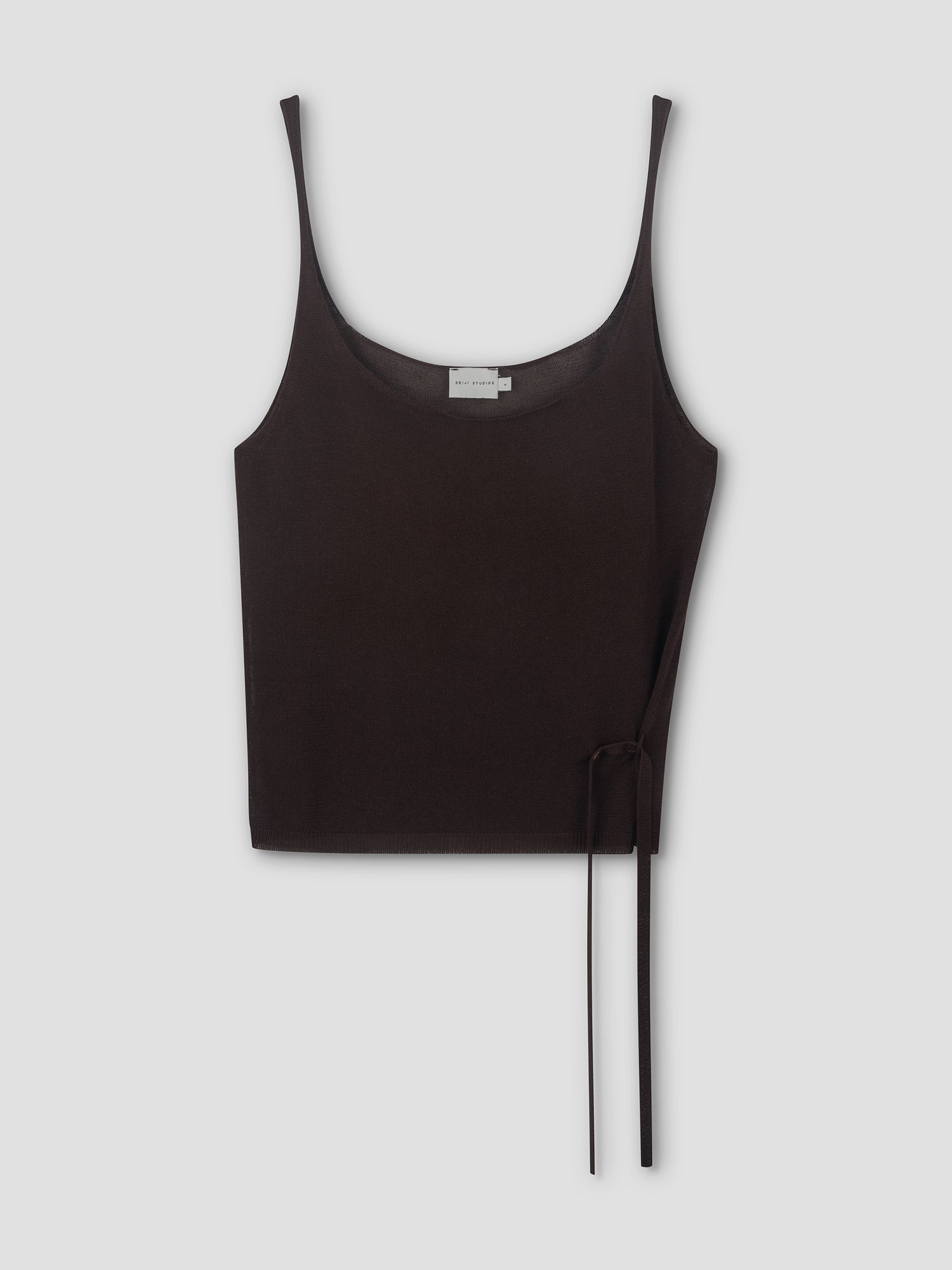 A Square Knit Top by Deiji Studios in brown, featuring a sleeveless cropped silhouette with thin straps and a wrap detail tied in a bow at the lower right, displayed against a plain light gray background.