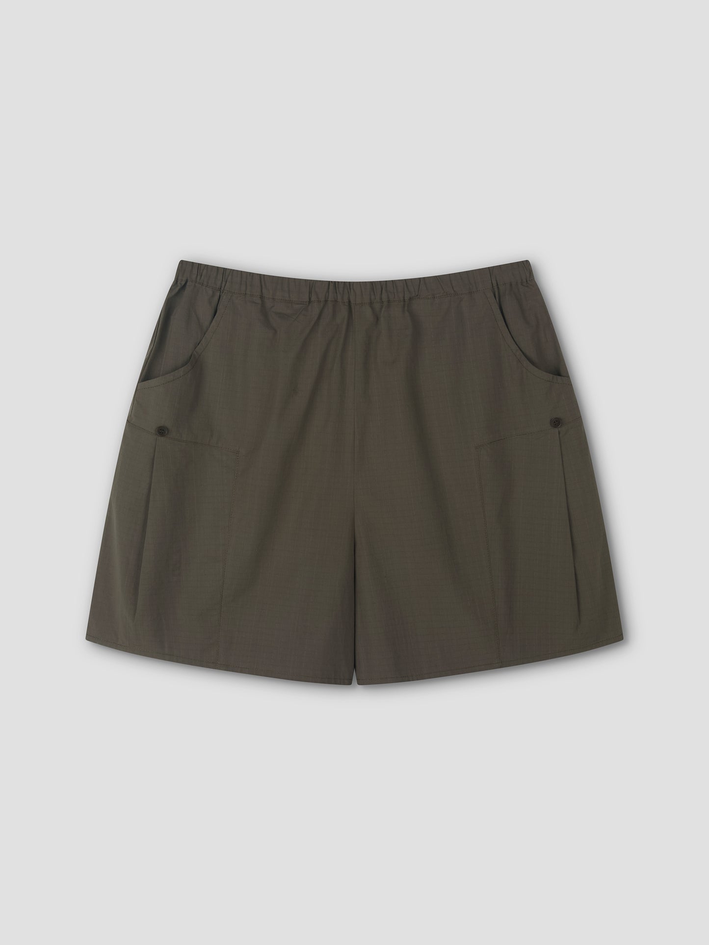 A pair of Deiji Studios Pleat Short - Khaki Check with an elastic waistband and two front pockets, laid flat on a light gray background.