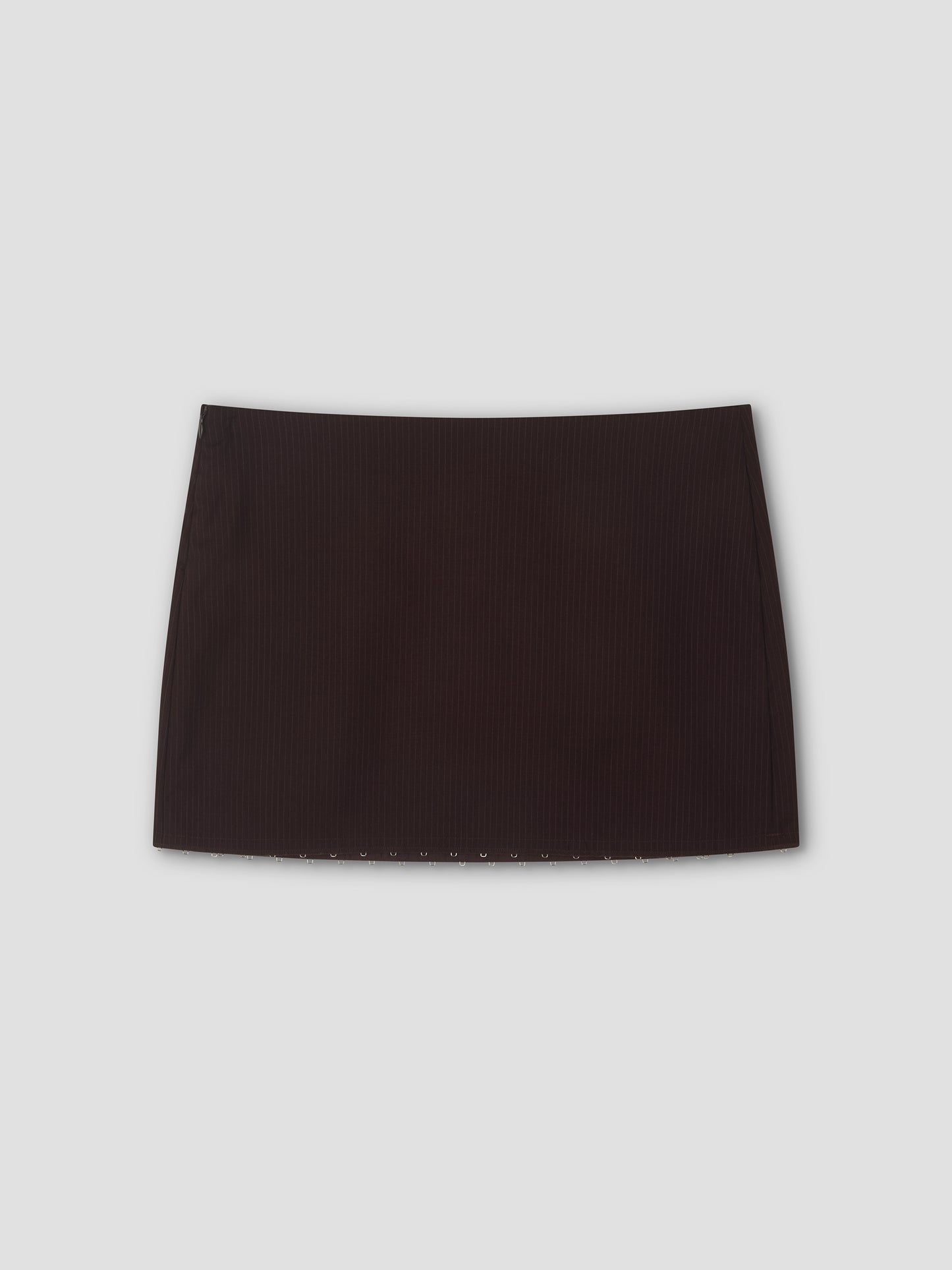 A mini-length Eye Skirt in burgundy brown stripes with a straight cut, displayed against a light gray background.