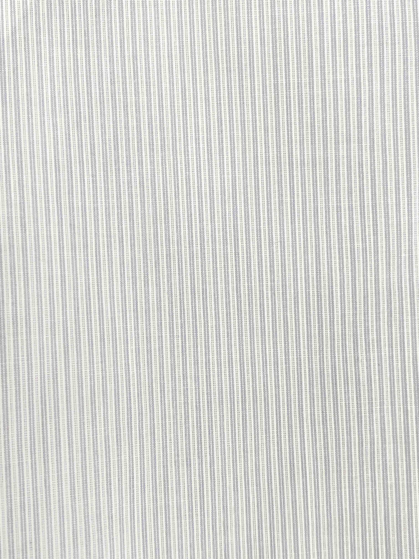 Close up shot of Dream Stripe fabric. A soft blue woven micro stripe on white.