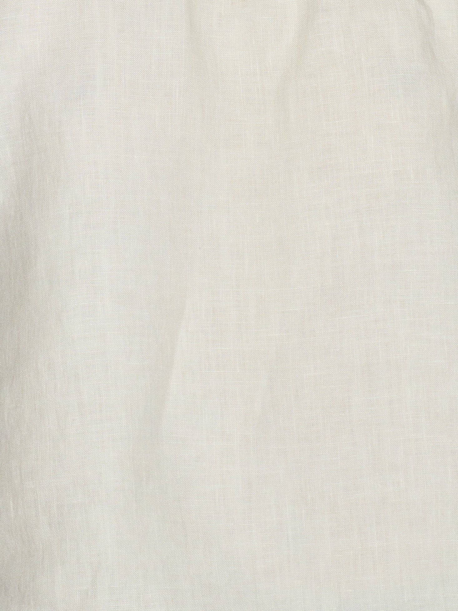 Close-up of the Strapless Linen Dress in Pastel Pistachio, showcasing its off-white organic linen fabric with subtle woven texture and soft, natural folds.