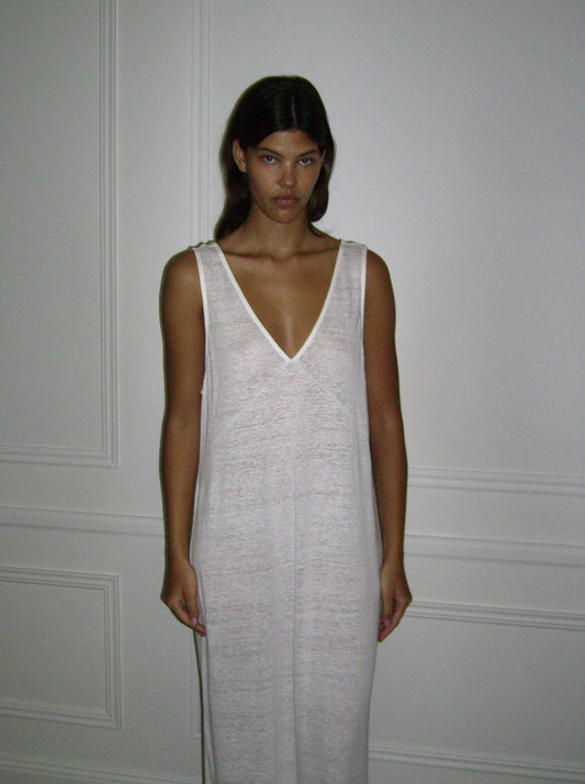 Female model wearing soft tank dress - ecru by Deiji Studios against plain background