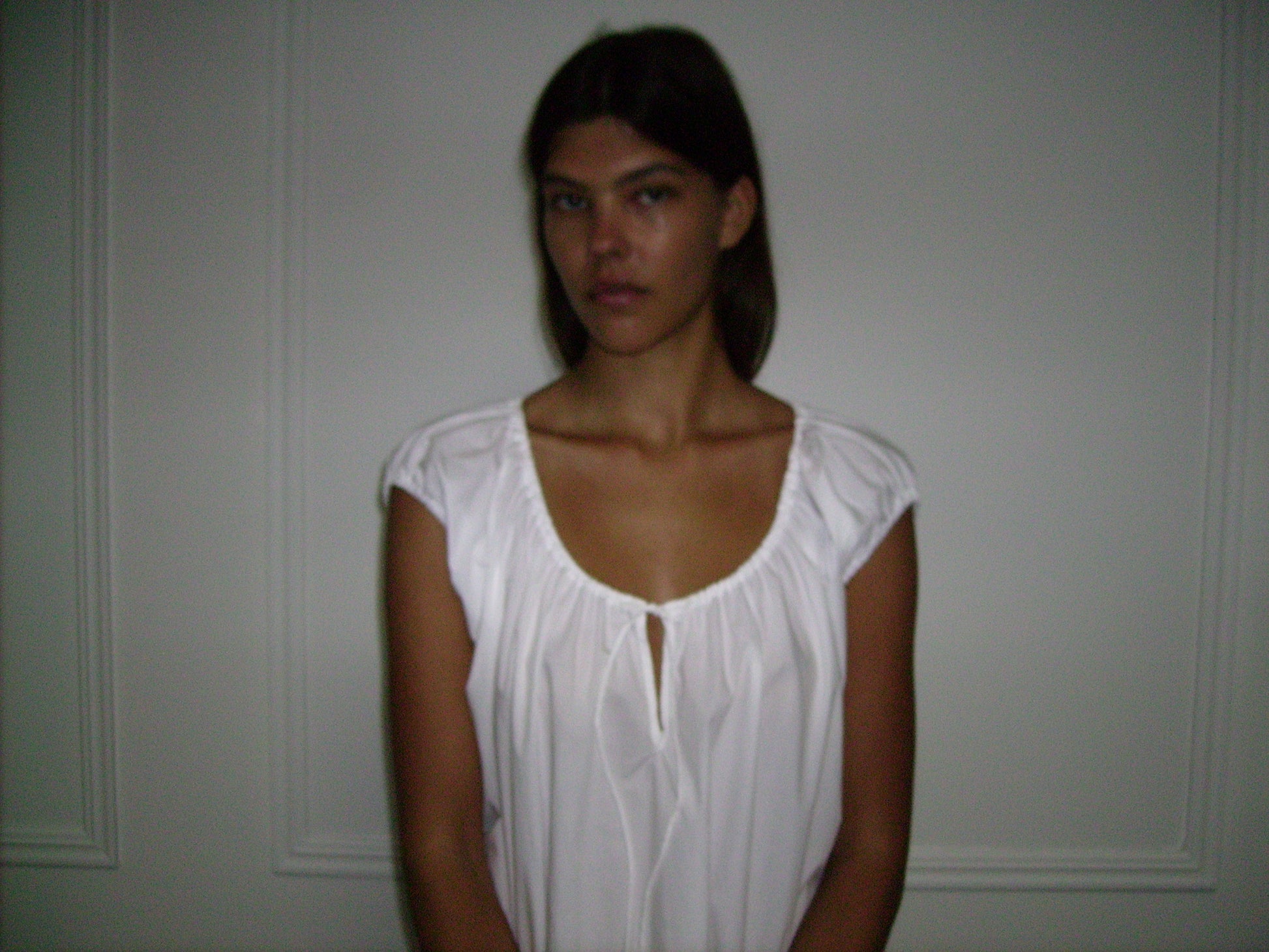 Female model wearing Capped Sleeve Dress - White by Deiji Studios against plain background