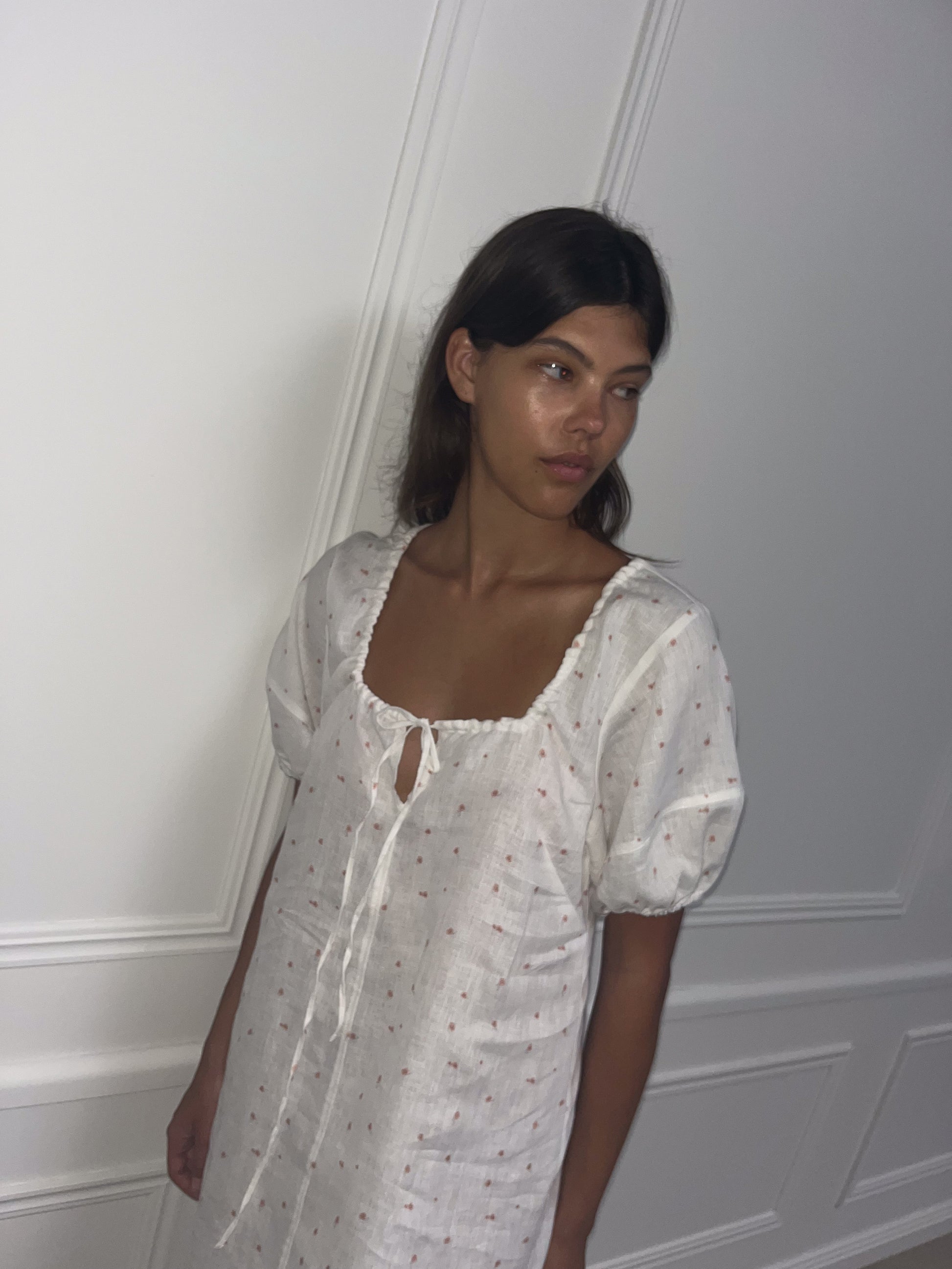 Female model wearing Curved Seam Midi Dress - Corsage Print by Deiji Studios against plain background