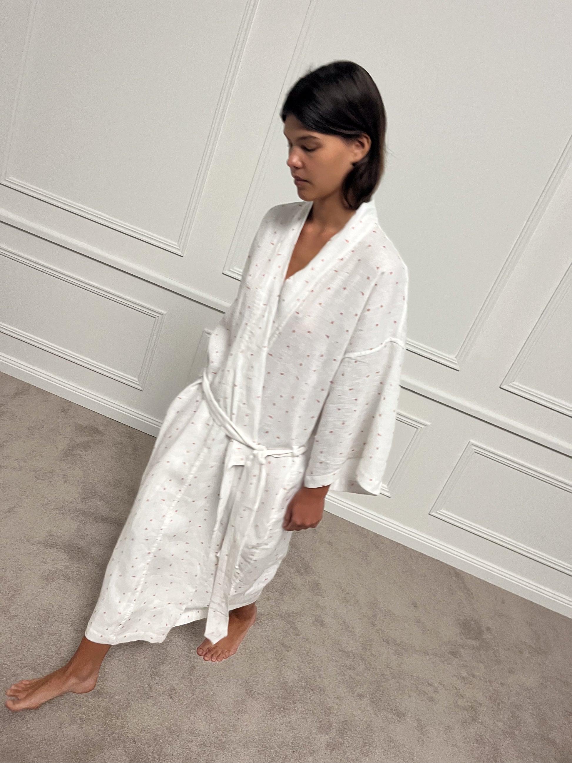 High angle shot of female model wearing the 02 Robe - Corsage Print - Deiji Studios