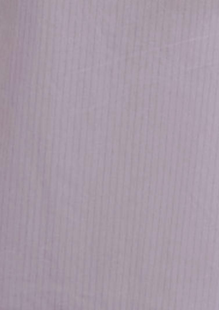 The Flounce Short - Lilac Stripe features light purple organic cotton with subtle vertical pinstripes, creating a soft texture and delicate, evenly spaced striped pattern.