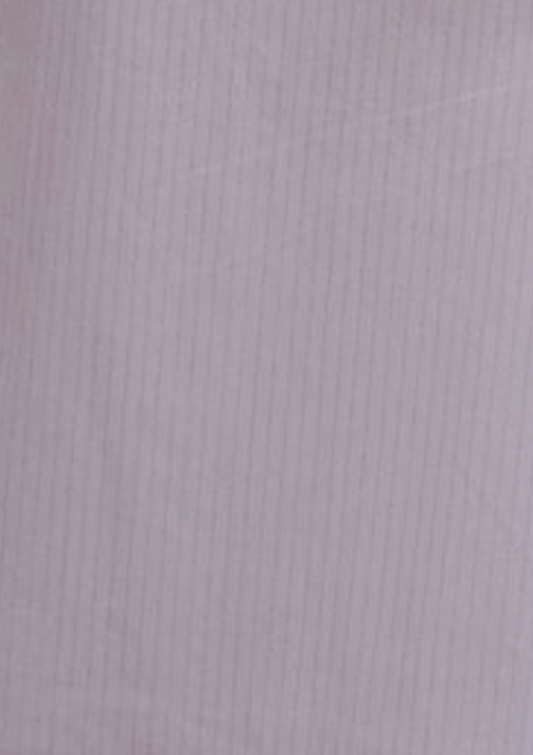 The Flounce Short - Lilac Stripe features light purple organic cotton with subtle vertical pinstripes, creating a soft texture and delicate, evenly spaced striped pattern.