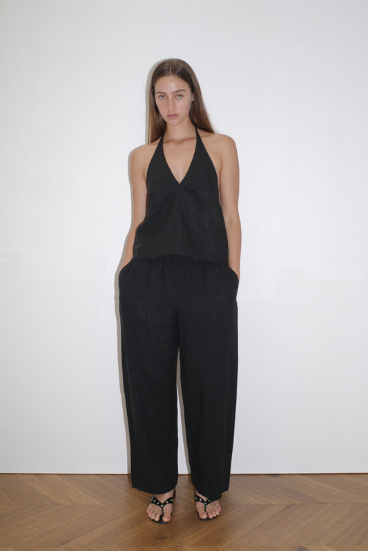 female model wears the linen pinched halter top by Deiji Studios in black

relaxed halter top features flattering v neckline, centre bust pleats and adjustable backline with drawcord tie closure

made from 100% OEKO-TEX 100 certified and EU certified stone washed french linen

paired with a black linen trouser