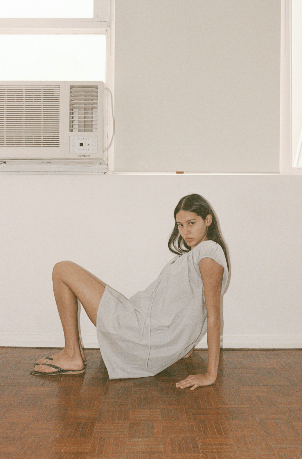 Female model wearing Capped Sleeve Dress - Dream Stripe by Deiji Studios against plain background