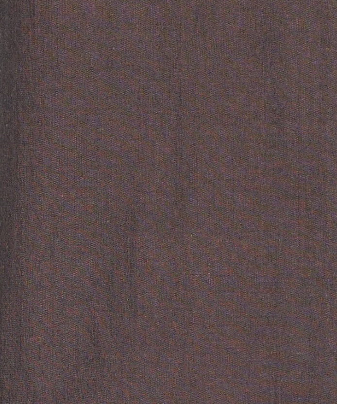 Close-up of brown textured fabric with visible weave patterns and subtle color variations, reminiscent of the premium materials used in the Collar Point Pant - Toast.