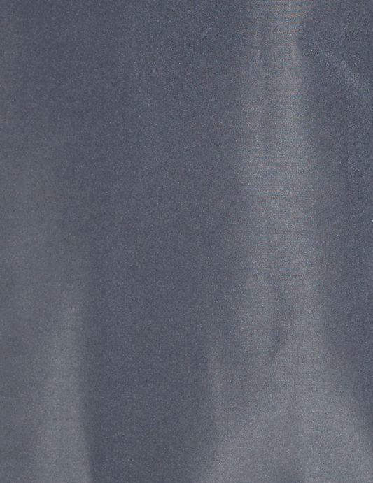 A close-up of a smooth, shiny slate-gray fabric with subtle light reflections and a slightly metallic sheen, evocative of the luxurious materials featured in the Gathered Jacket - Slate by deiji studios.
