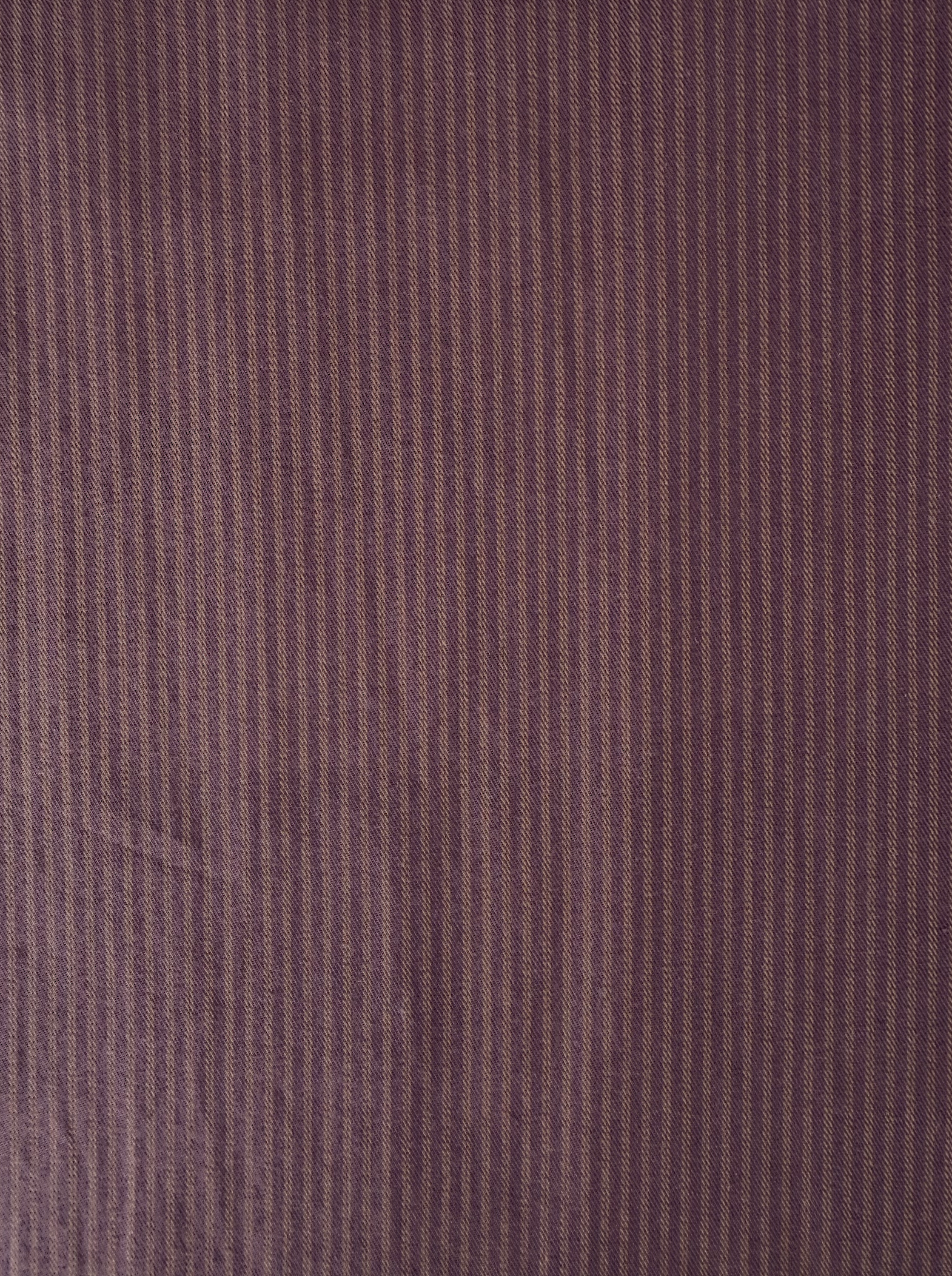 Close-up of the Loop Pant - Mulberry Stripe fabric, featuring thin vertical brown and purple mulberry stripes that create a subtle, textured pattern—ideal for crafting a relaxed straight leg or loop pant.