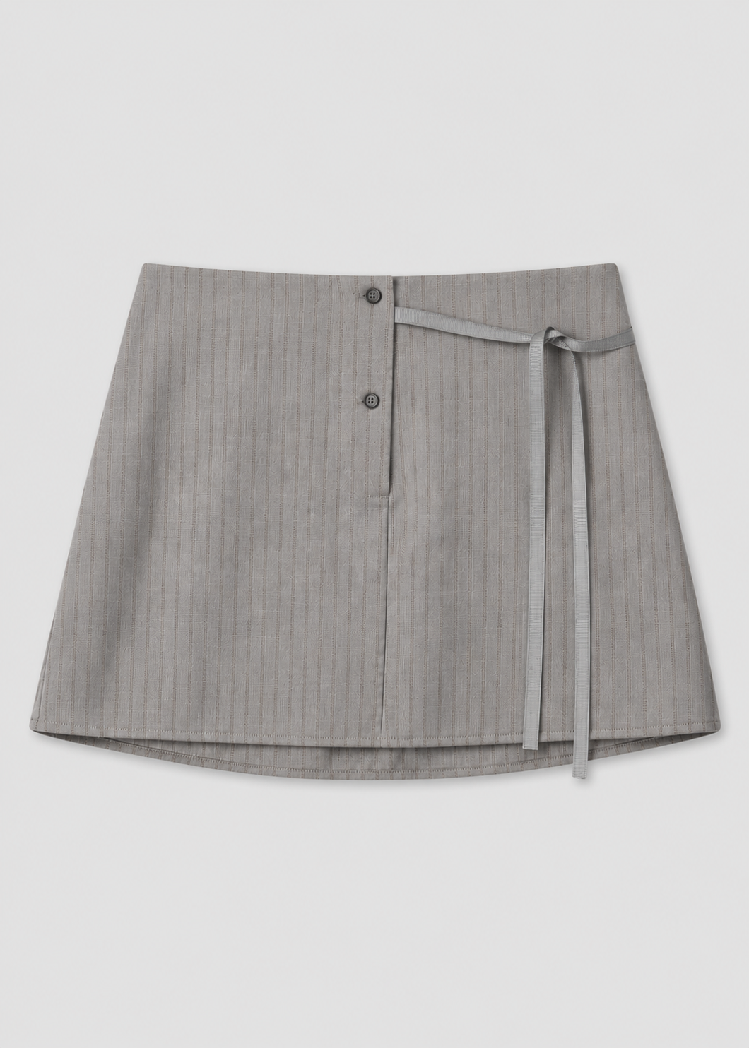The Wool Tie Mini Skirt - Grey Stripe by Deiji Studios features a subtle wrap design, two front buttons, and a slim matching tie on the right side, shown against a white background.
