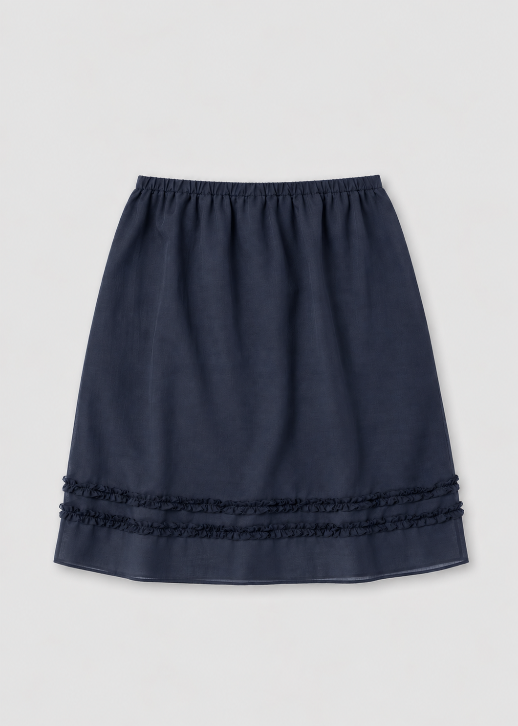 The Daytime Skirt - Navy by Deiji Studios laid flat against a plain white background, a cotton voile midi skirt in navy with a soft elasticated waistband, a straight silhouette and double frill detailing at the hem.